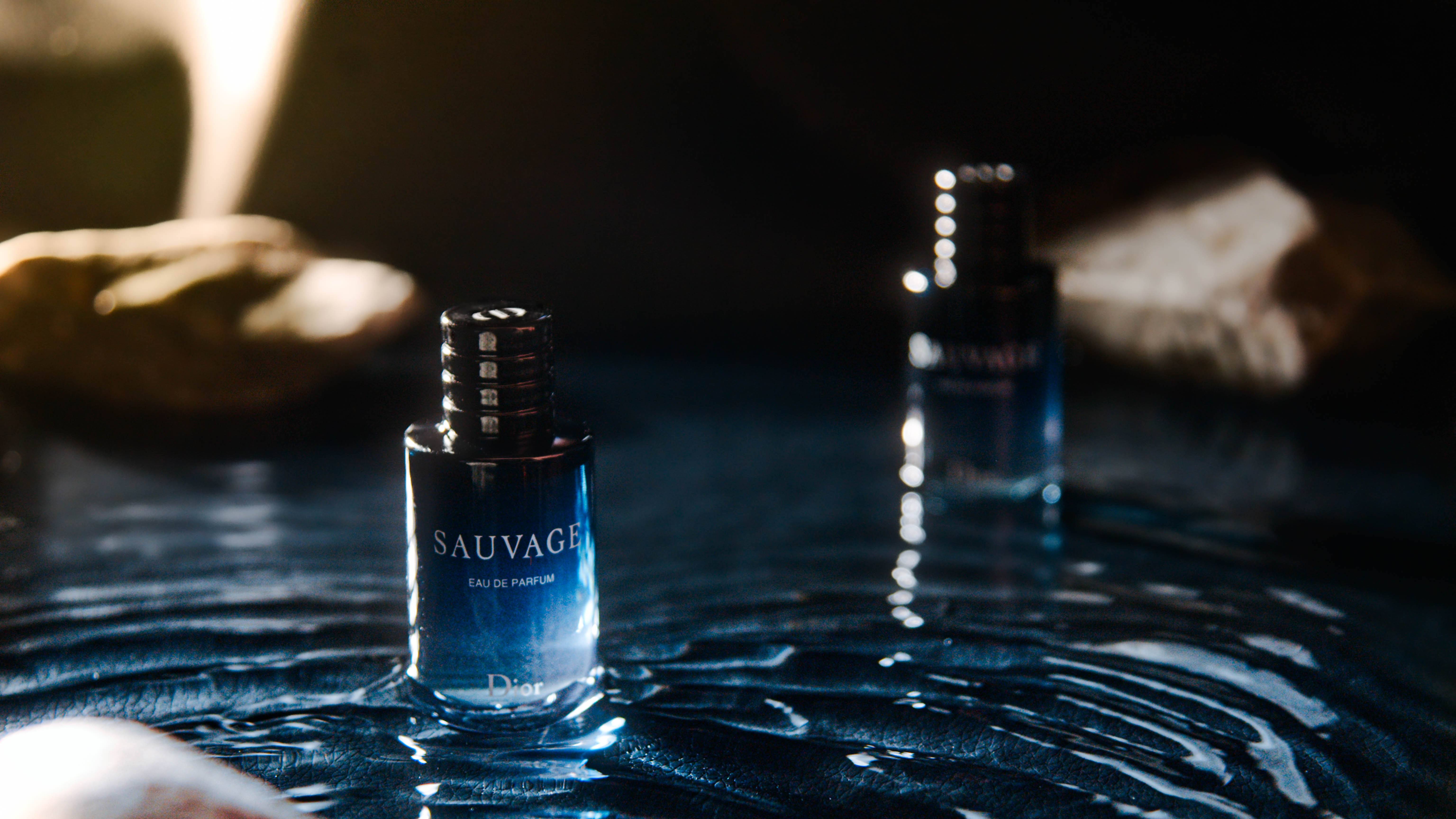 Dior Sauvage bottles on rippling water